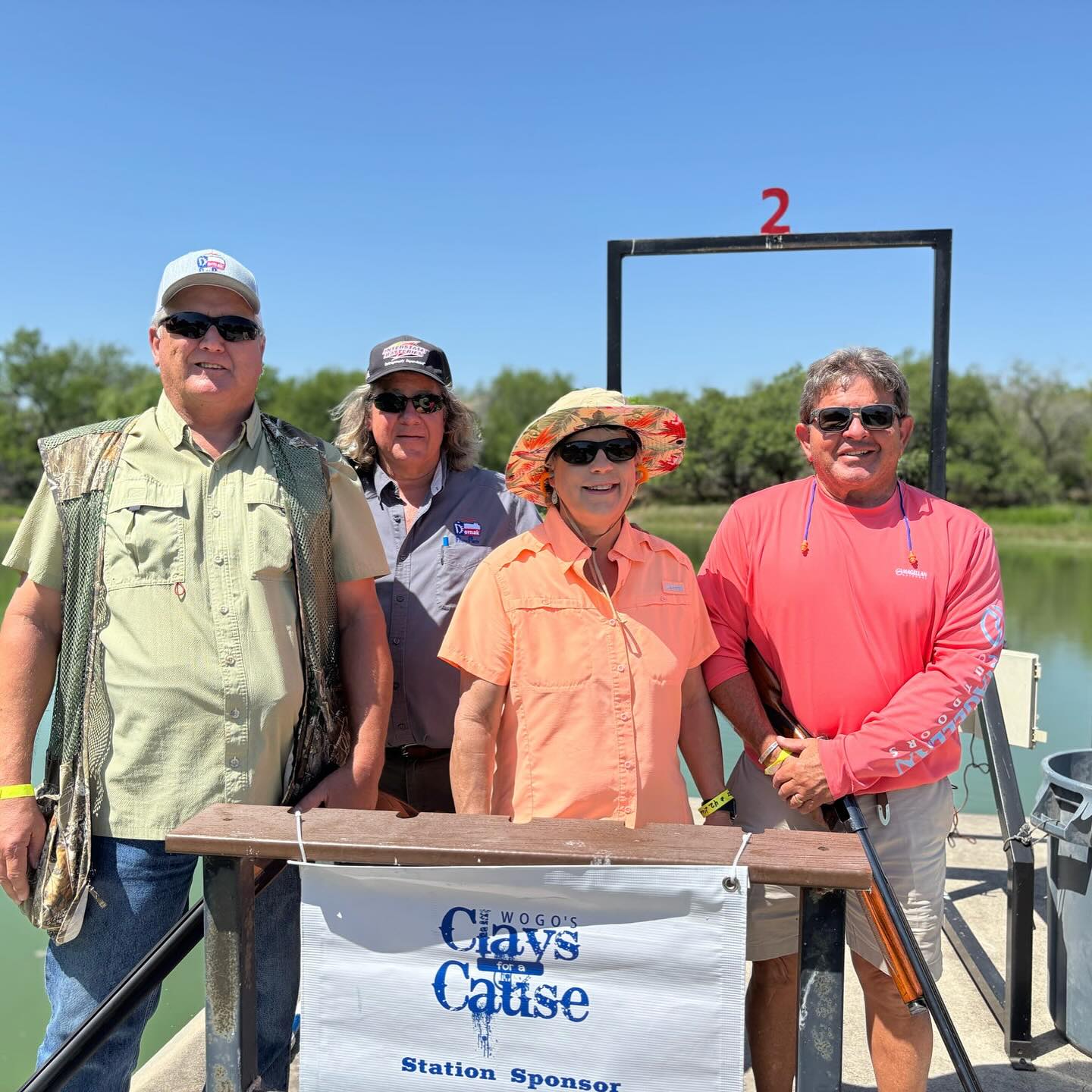 group of event attendees at a skeet stand