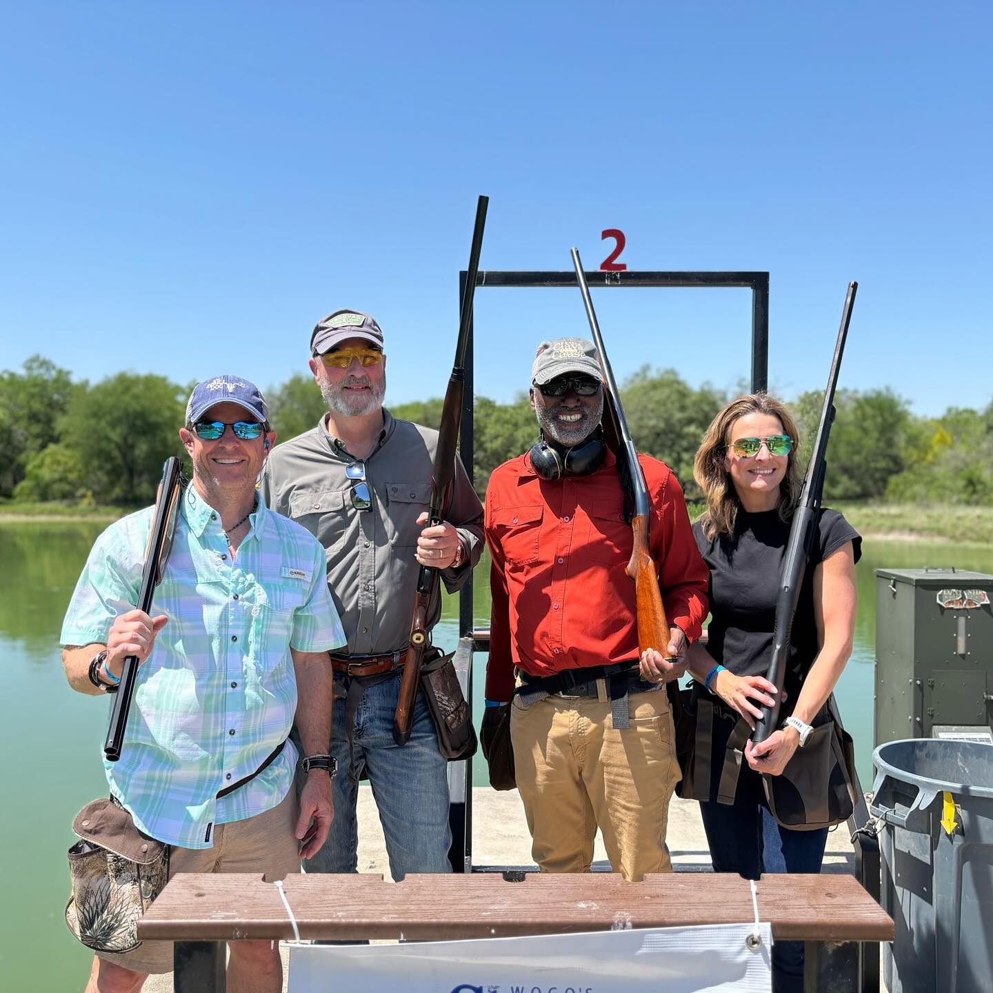 group of event attendees at a skeet stand